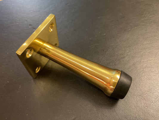 445 - Polished brass wall mounted 76 mm door stop