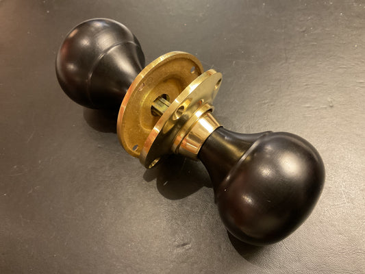 8034B - Ebony Bun Door Knobs On Polished Brass