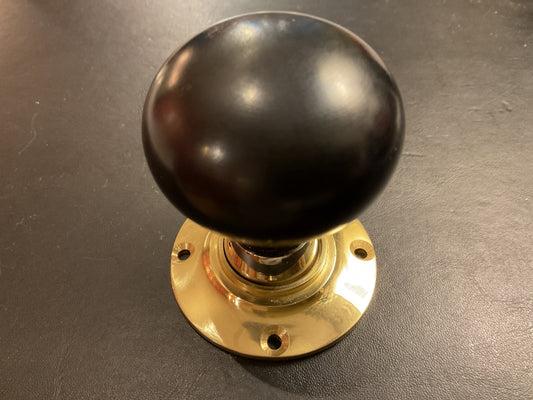 8038 - Ebony 55 mm Bun Door Knobs on Polished Brass